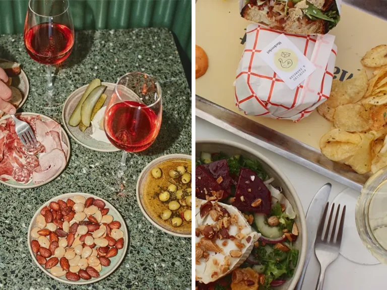 Rosévin och serverade smårätter på restaurangbord.